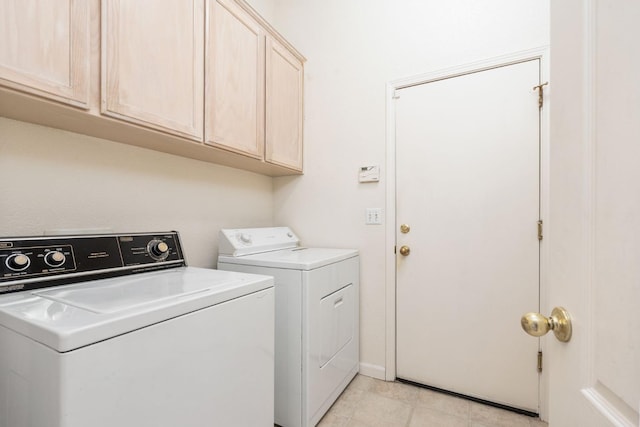 9416 N Jade Ave, Fresno, CA 93720 - laundry area featuring washer and clothes dryer, cabinet space, and light tile patterned flooring