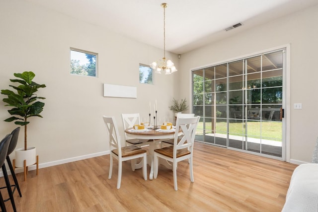 9416 N Jade Ave, Fresno, CA 93720 - dining space featuring light wood-style floors and a chandelier