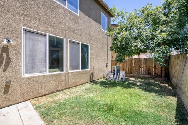 7345 E Giavanna Ave, Fresno, CA 93737 - view of side of home featuring stucco siding and a fenced backyard