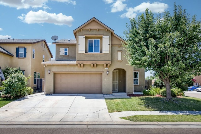 7345 E Giavanna Ave, Fresno, CA 93737 - traditional-style home with a garage, stucco siding, driveway, and a front yard