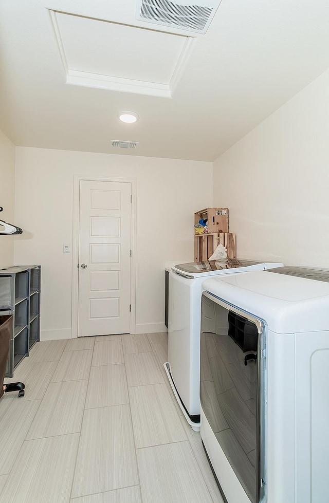 463 Mesa Dr S, Madera, CA 93636 - laundry room with washer and clothes dryer and recessed lighting
