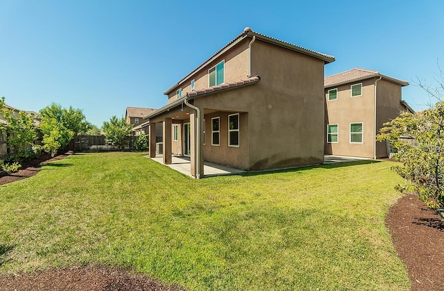 463 Mesa Dr S, Madera, CA 93636 - back of house featuring a patio, stucco siding, and a fenced backyard