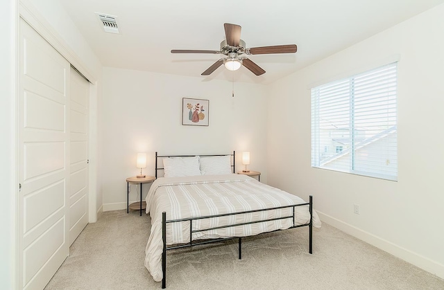 463 Mesa Dr S, Madera, CA 93636 - bedroom featuring light colored carpet, a closet, and a ceiling fan