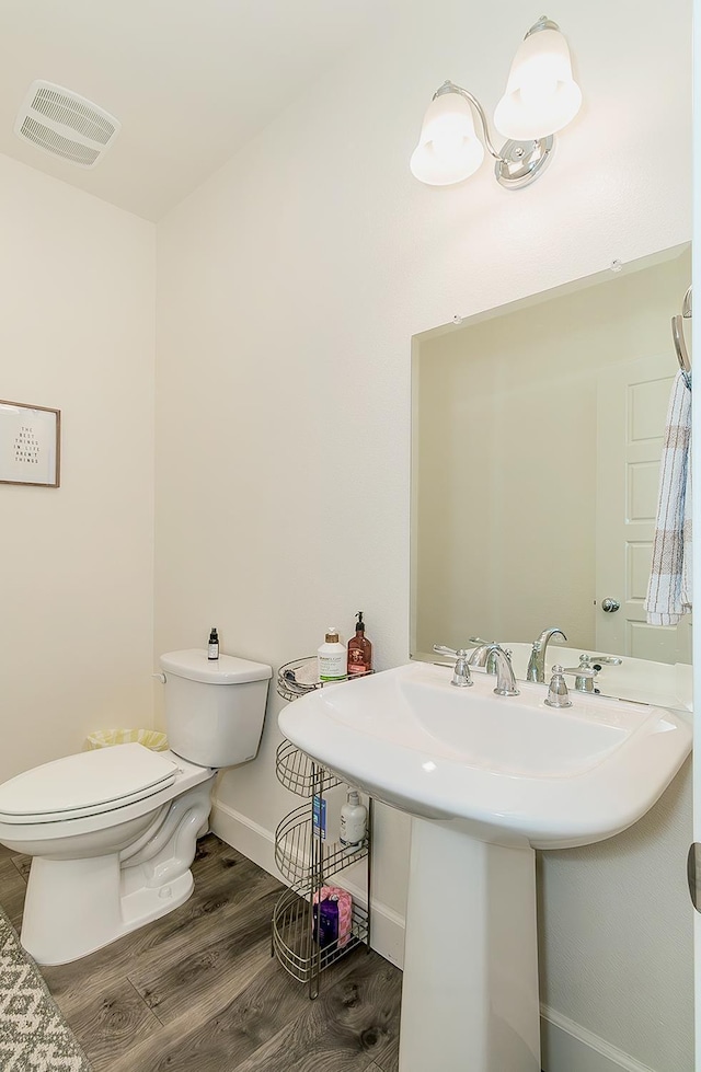 463 Mesa Dr S, Madera, CA 93636 - half bath with wood finished floors and toilet