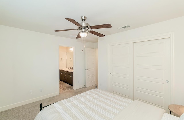463 Mesa Dr S, Madera, CA 93636 - bedroom with light carpet, a closet, ensuite bath, and ceiling fan