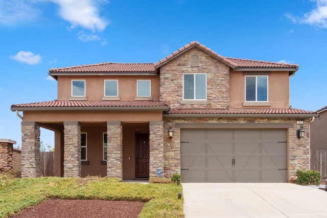 463 Mesa Dr S, Madera, CA 93636 - mediterranean / spanish home with a tile roof, stone siding, concrete driveway, and a garage