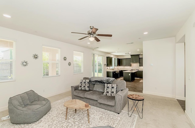 463 Mesa Dr S, Madera, CA 93636 - living room with a ceiling fan, recessed lighting, and light colored carpet