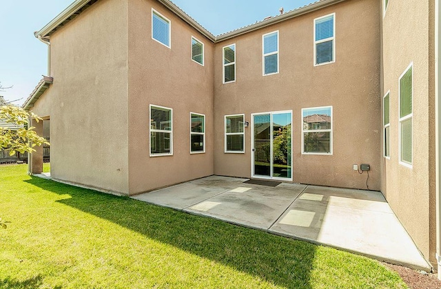 463 Mesa Dr S, Madera, CA 93636 - back of house with a patio, a yard, and stucco siding