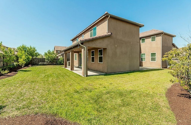 463 Mesa Dr S, Madera, CA 93636 - back of property with a patio, a fenced backyard, and stucco siding