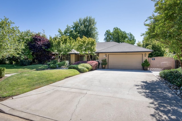 6328 N Benedict Ave, Fresno, CA 93711 - view of front of home featuring concrete driveway, a garage, a front yard, and a gate