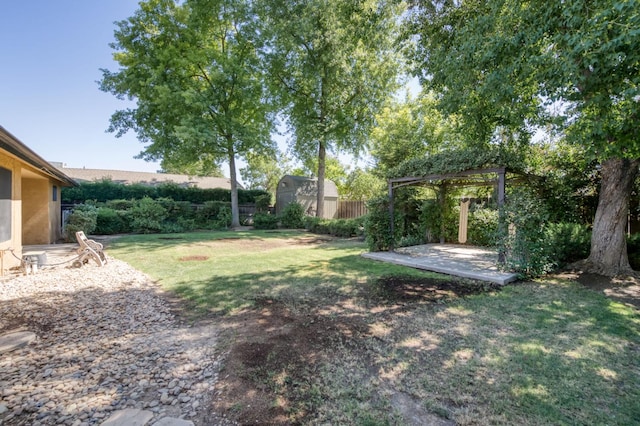 6328 N Benedict Ave, Fresno, CA 93711 - fenced backyard with a storage shed and a patio