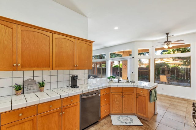 5613 W Bluff Ave, Fresno, CA 93722 - kitchen with dishwashing machine, decorative backsplash, light tile patterned flooring, a ceiling fan, and recessed lighting