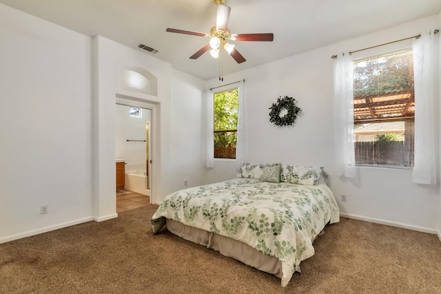 5613 W Bluff Ave, Fresno, CA 93722 - bedroom with carpet floors, a ceiling fan, and ensuite bath
