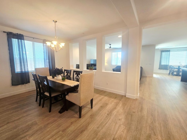 117 Emperor Way, Dinuba, CA 93618 - dining room with a chandelier and light wood-style flooring