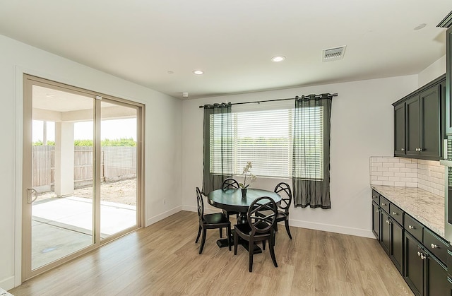 117 Emperor Way, Dinuba, CA 93618 - dining space featuring light wood finished floors, plenty of natural light, and recessed lighting