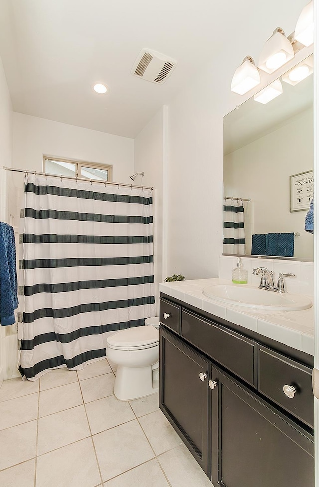 117 Emperor Way, Dinuba, CA 93618 - bathroom with tile patterned floors, vanity, and a shower with curtain