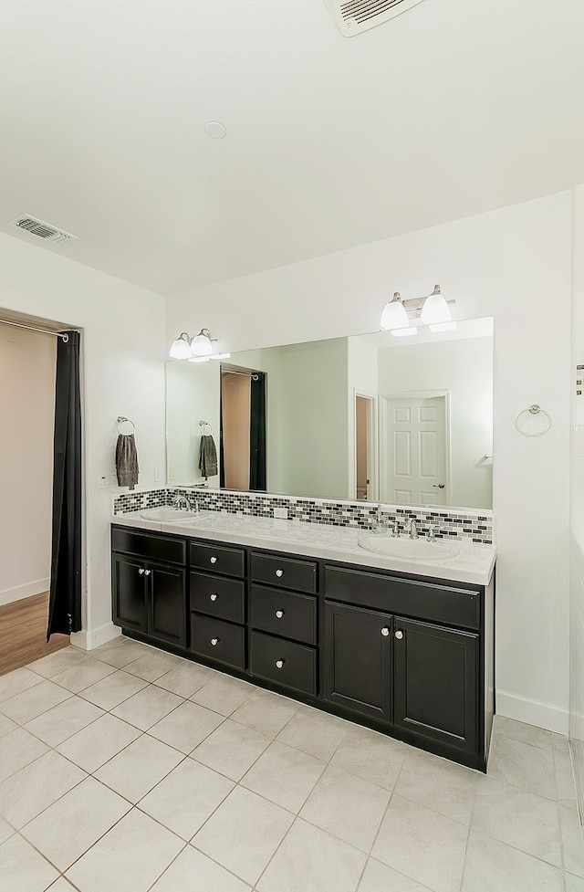117 Emperor Way, Dinuba, CA 93618 - bathroom with double vanity and tile patterned floors