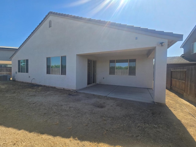 117 Emperor Way, Dinuba, CA 93618 - back of house featuring a patio and stucco siding