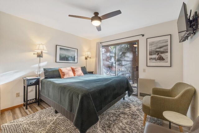 40607 Mill Run Ln Unit 72, Shaver Lake, CA 93664 - bedroom with access to outside, light wood-style flooring, and a ceiling fan