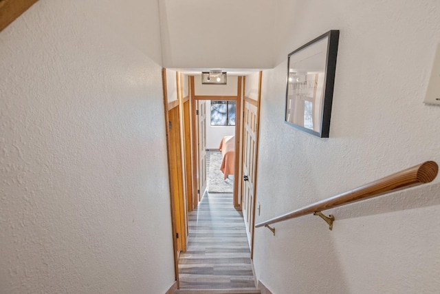 40607 Mill Run Ln Unit 72, Shaver Lake, CA 93664 - corridor featuring wood finished floors and a textured wall