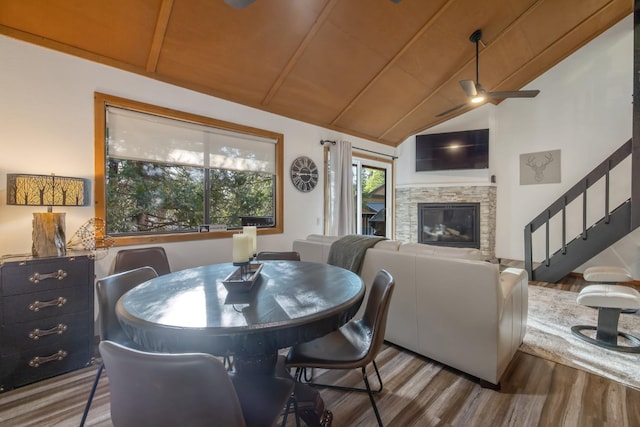 40607 Mill Run Ln Unit 72, Shaver Lake, CA 93664 - dining area with wood finished floors, ceiling fan, stairs, a fireplace, and wood ceiling