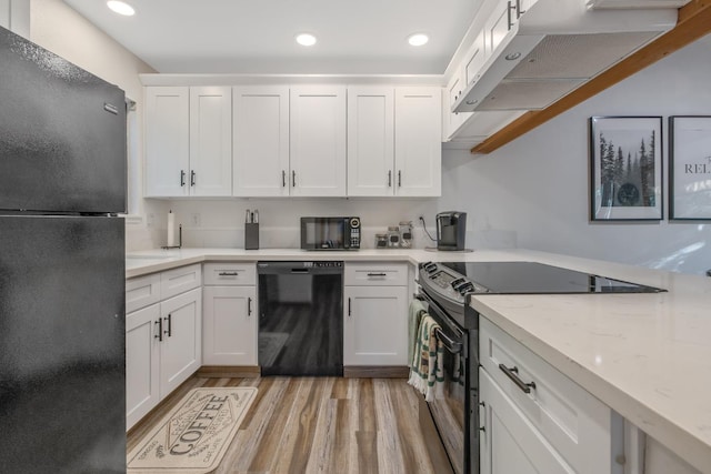 40607 Mill Run Ln Unit 72, Shaver Lake, CA 93664 - kitchen with black appliances, ventilation hood, white cabinets, light wood finished floors, and recessed lighting