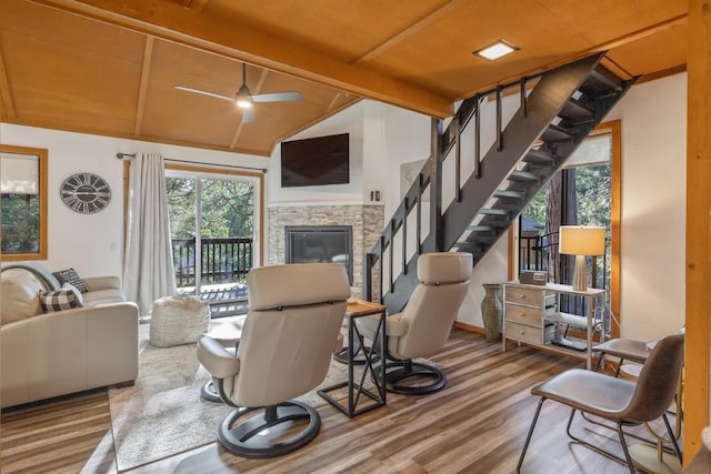 40607 Mill Run Ln Unit 72, Shaver Lake, CA 93664 - living area featuring wood finished floors, ceiling fan, a stone fireplace, and stairs