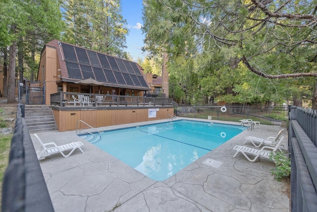 40607 Mill Run Ln Unit 72, Shaver Lake, CA 93664 - community pool featuring view of wooded area and a patio area