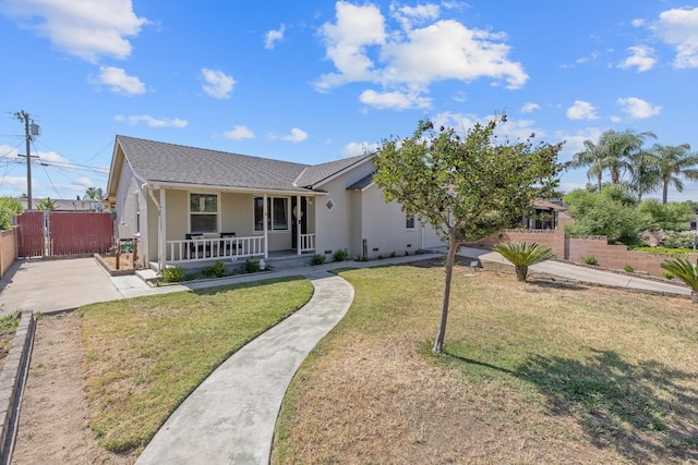 723 N Lourae Ave, Reedley, CA 93654 - ranch-style house featuring covered porch, stucco siding, and roof with shingles