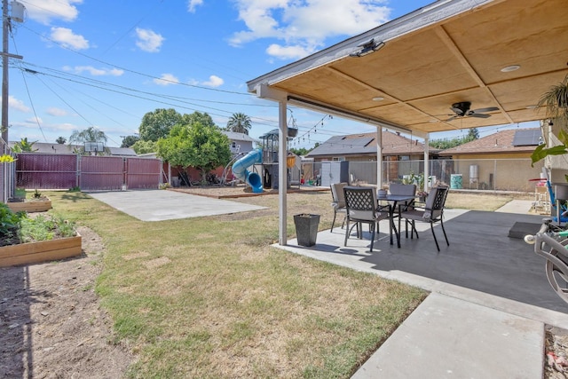 723 N Lourae Ave, Reedley, CA 93654 - fenced backyard with a playground and a patio