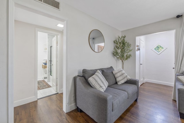 723 N Lourae Ave, Reedley, CA 93654 - living area with dark wood-type flooring and baseboards