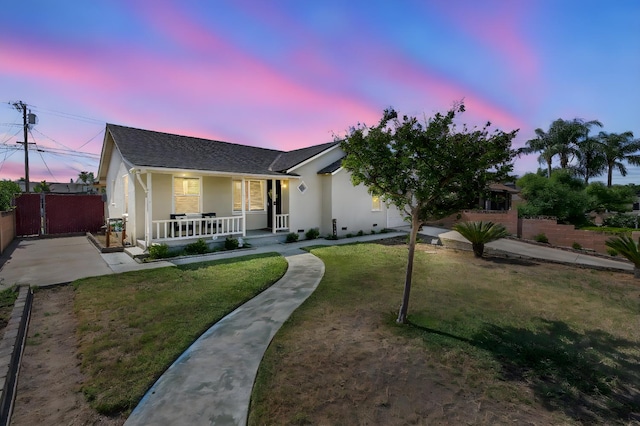 723 N Lourae Ave, Reedley, CA 93654 - ranch-style house with a porch, stucco siding, and roof with shingles