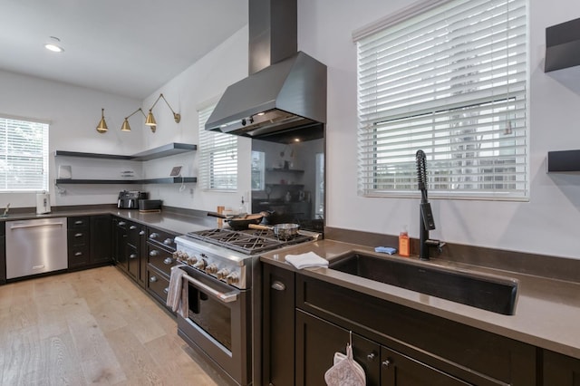 4240 Rall Ave, Clovis, CA 93619 - kitchen featuring wall chimney range hood, appliances with stainless steel finishes, open shelves, light wood finished floors, and dark countertops