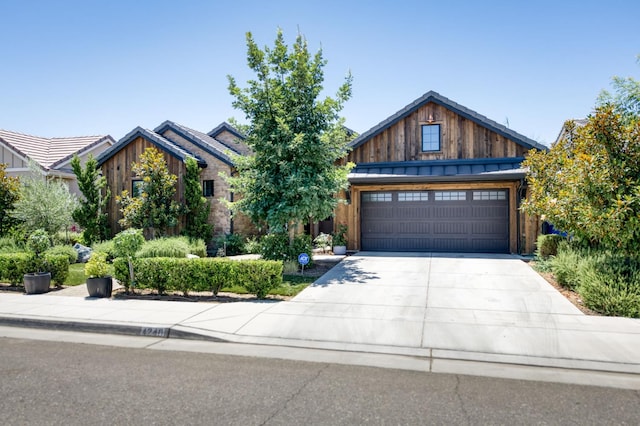4240 Rall Ave, Clovis, CA 93619 - craftsman-style house featuring concrete driveway, a garage, and board and batten siding