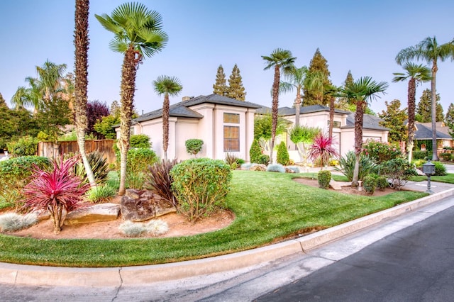7334 N Geraldine Ave, Fresno, CA 93711 - view of front of home featuring stucco siding and an attached garage