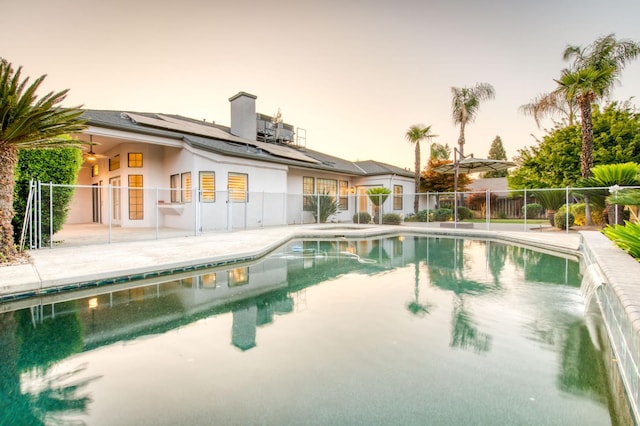 7334 N Geraldine Ave, Fresno, CA 93711 - pool at dusk featuring a patio