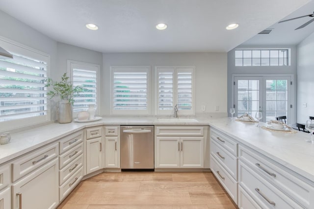 7334 N Geraldine Ave, Fresno, CA 93711 - kitchen featuring stainless steel dishwasher, healthy amount of natural light, light stone countertops, recessed lighting, and light wood-style flooring