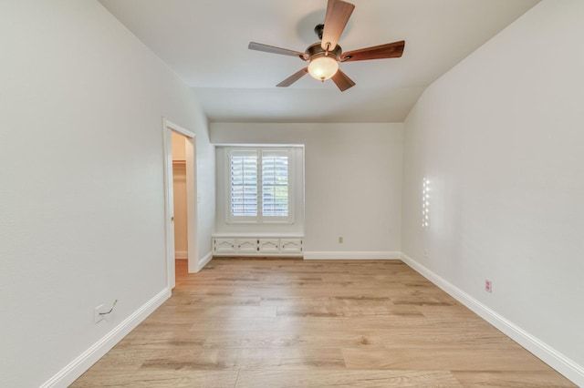 7334 N Geraldine Ave, Fresno, CA 93711 - spare room featuring a ceiling fan, light wood-style floors, and lofted ceiling