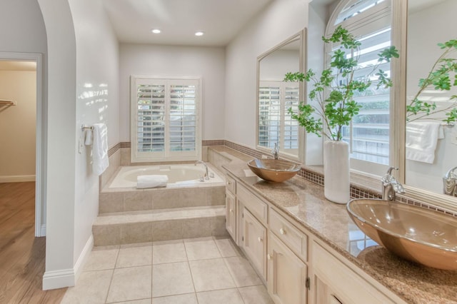 7334 N Geraldine Ave, Fresno, CA 93711 - bathroom featuring double vanity, a garden tub, and recessed lighting