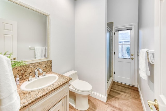 7334 N Geraldine Ave, Fresno, CA 93711 - bathroom with wood finished floors, vanity, and a stall shower
