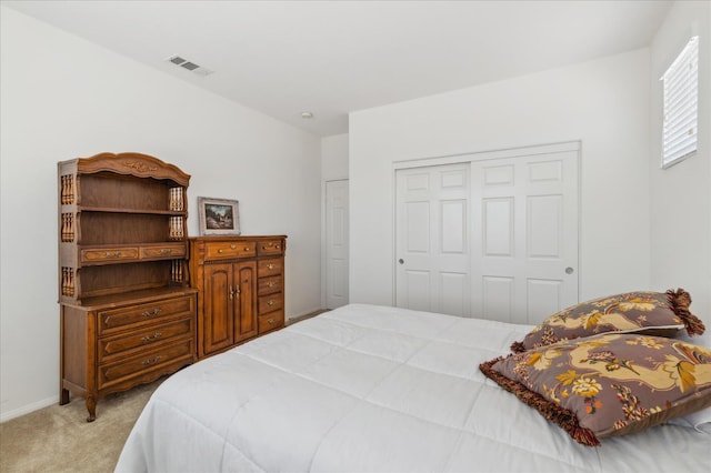 18555 Malkoha St, Riverside, CA 92570 - bedroom featuring light colored carpet and a closet