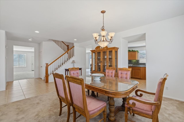 18555 Malkoha St, Riverside, CA 92570 - dining area with a chandelier, light carpet, plenty of natural light, stairway, and recessed lighting