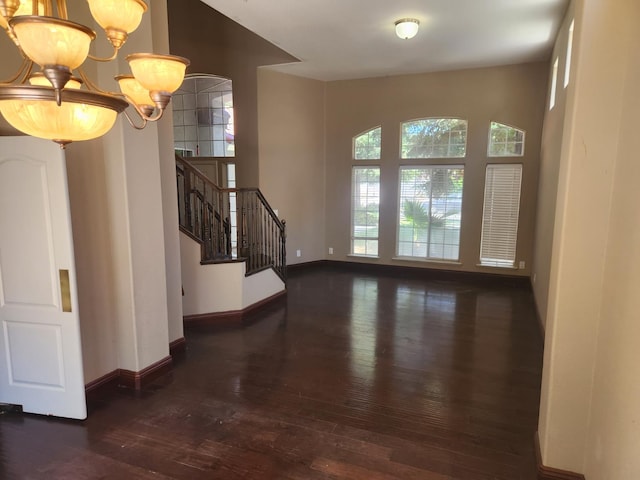 9063 N Woodrow Ave, Fresno, CA 93720 - entryway with a chandelier, hardwood / wood-style floors, and stairs