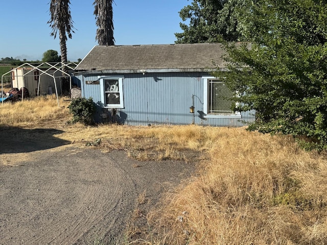 8193 Azusa Ave, Dos Palos, CA 93620 - view of front facade with roof with shingles