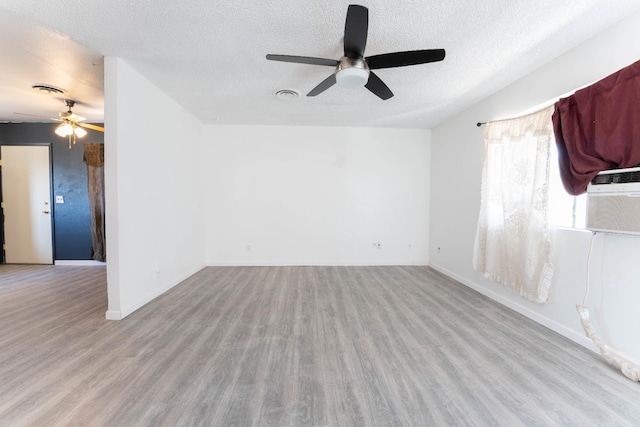 603 E Compton Ave, Pixley, CA 93256 - spare room with a ceiling fan, wood finished floors, and a textured ceiling