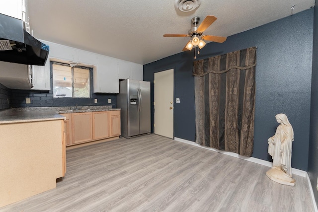 603 E Compton Ave, Pixley, CA 93256 - kitchen with stainless steel refrigerator with ice dispenser, ventilation hood, a ceiling fan, light wood-type flooring, and a textured ceiling