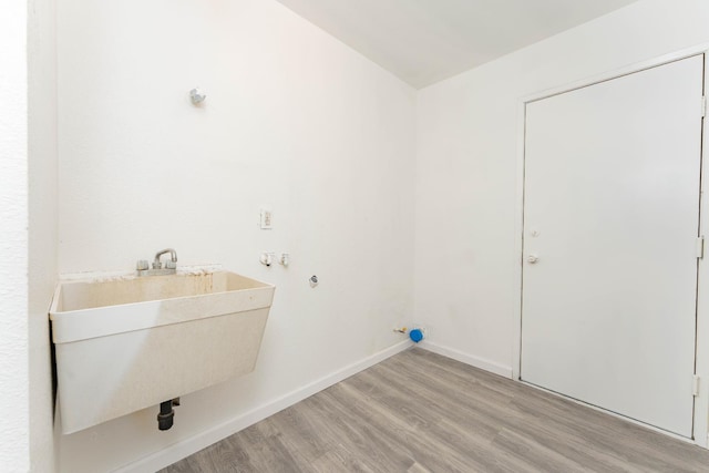 603 E Compton Ave, Pixley, CA 93256 - washroom featuring wood finished floors and baseboards