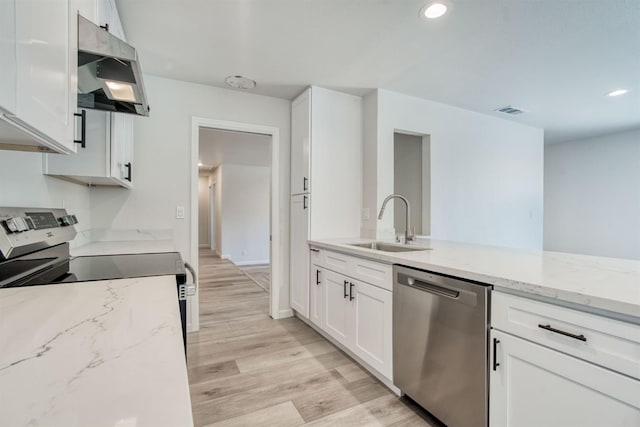 5276 N 1st St, Fresno, CA 93710 - kitchen featuring stainless steel appliances, under cabinet range hood, light stone counters, white cabinets, and recessed lighting
