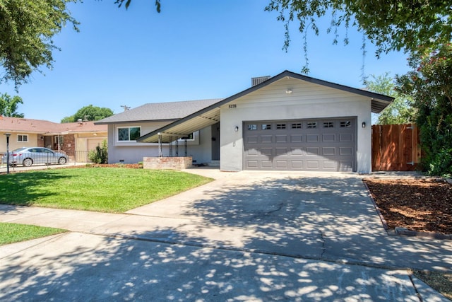 5276 N 1st St, Fresno, CA 93710 - ranch-style home featuring driveway, an attached garage, and stucco siding