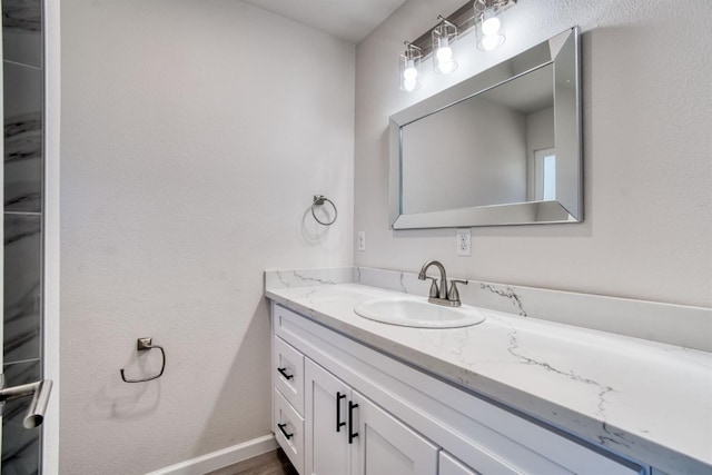5276 N 1st St, Fresno, CA 93710 - bathroom with vanity and wood finished floors